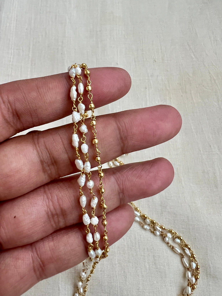 Gold chain with store pearl beads