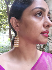 Gold polish pearl hanging jhumkas-Earrings-CI-House of Taamara