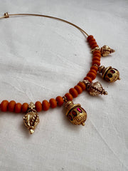 Gold polish hasli with coral beads and ruby motifs