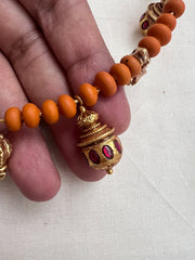 Gold polish hasli with coral beads and ruby motifs
