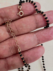 Mangalsutra style black bead chain with kundan & emerald bead pendant