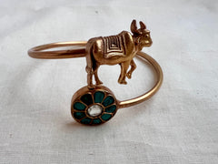 Gold polish kundan and turquoise kada with cow motif