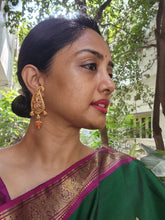 Paisley style statement earrings with coral drops
