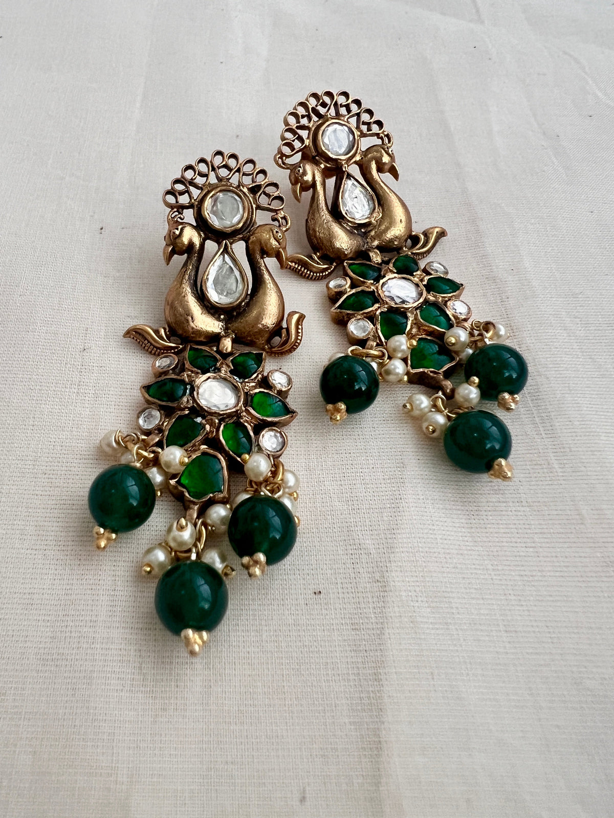 Antique gold polish kundan & emerald peacock earrings with pearls & green onyx beads-Earrings-CI-House of Taamara