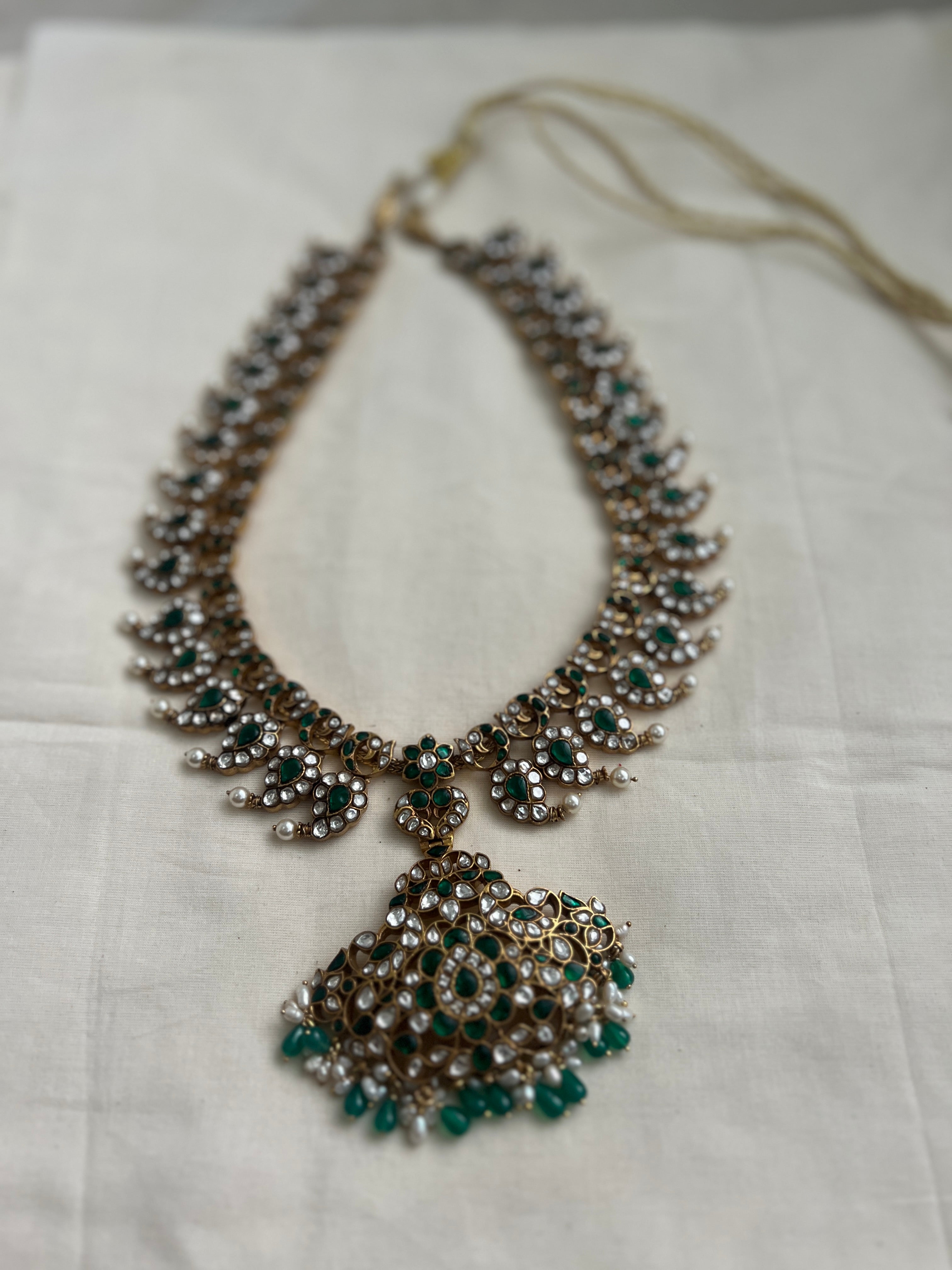 Gold polish statement kundan & emerald paisley necklace with pearls & green onyx beads-Silver Neckpiece-CI-House of Taamara