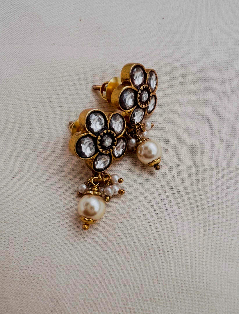 Gold polish kundan flower studs with pearls