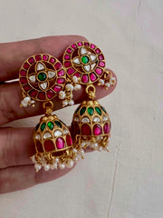 Gold polish kundan, ruby and emerald jhumkas with pearls