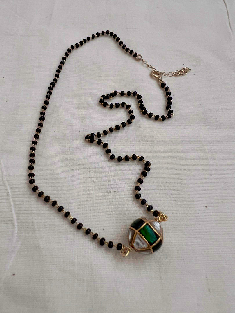 Mangalsutra style black bead chain with kundan & emerald bead pendant
