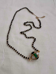 Mangalsutra style black bead chain with kundan & emerald bead pendant