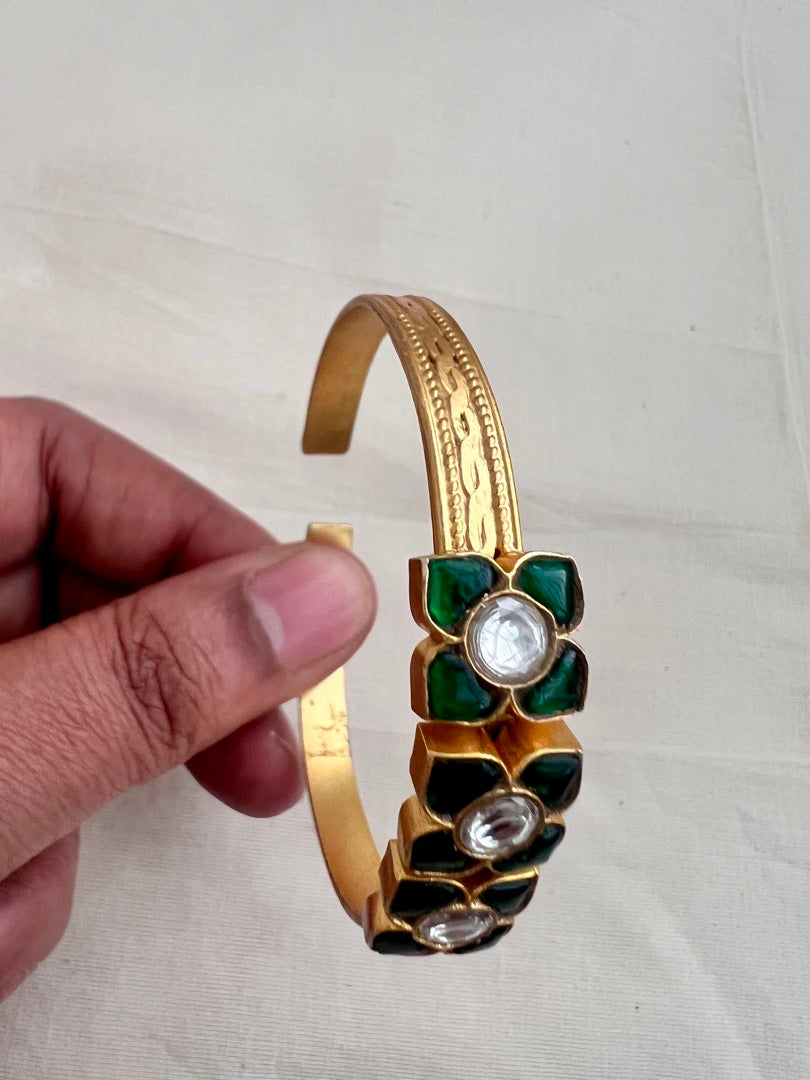 Gold polish kundan and emerald flower kada