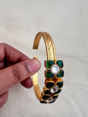 Gold polish kundan and emerald flower kada