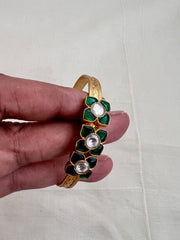 Gold polish kundan and emerald flower kada
