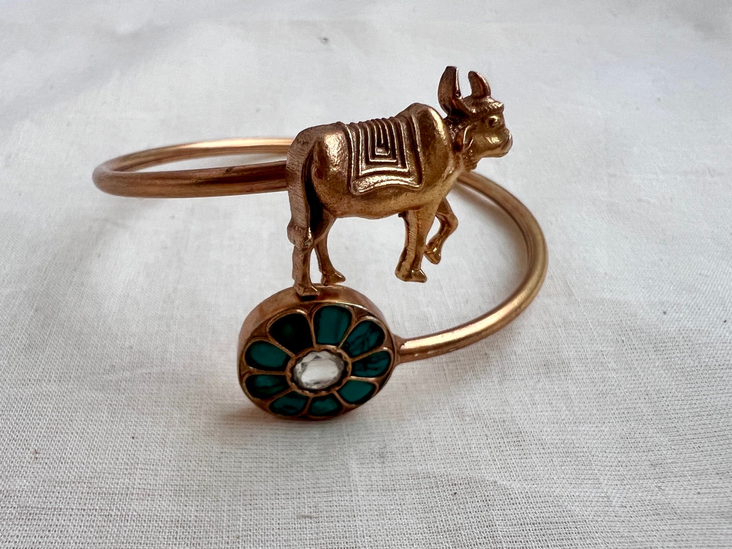 Gold polish kundan and turquoise kada with cow motif