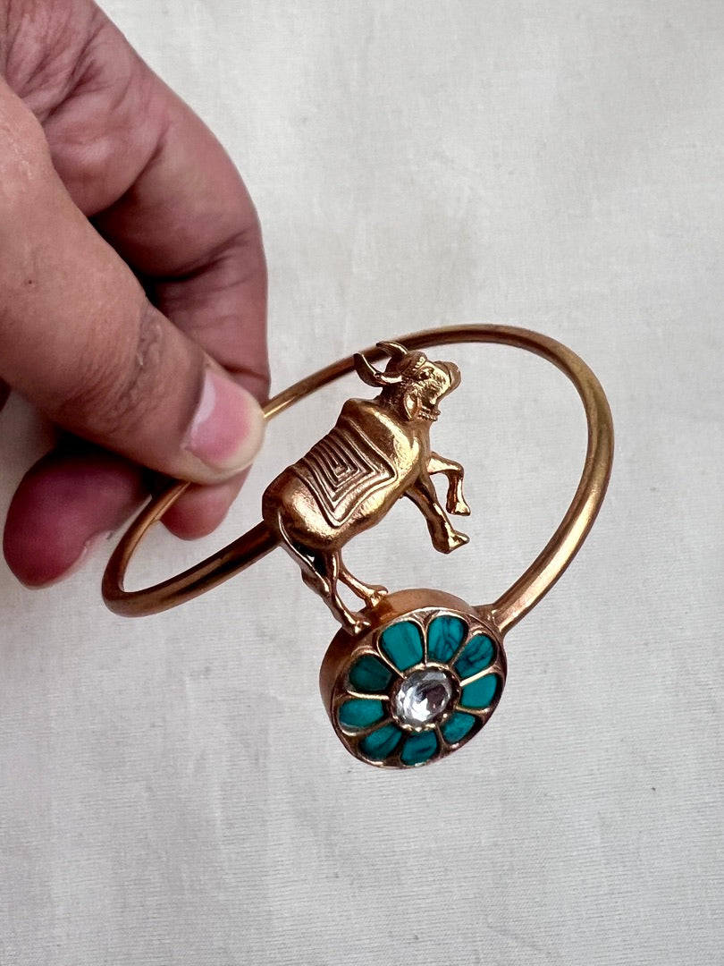 Gold polish kundan and turquoise kada with cow motif