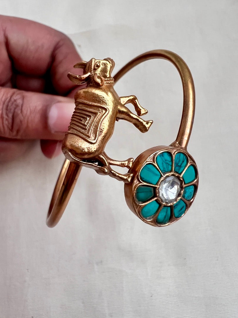 Gold polish kundan and turquoise kada with cow motif