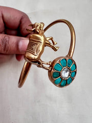 Gold polish kundan and turquoise kada with cow motif