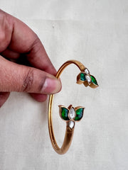Gold polish kundan and emerald flower kada