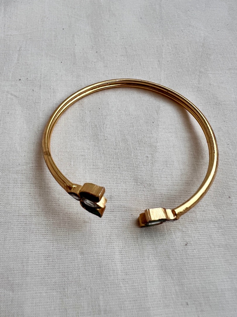 Gold polish kundan and emerald flower kada