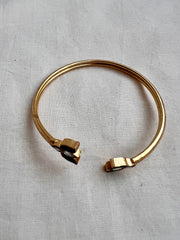 Gold polish kundan and emerald flower kada