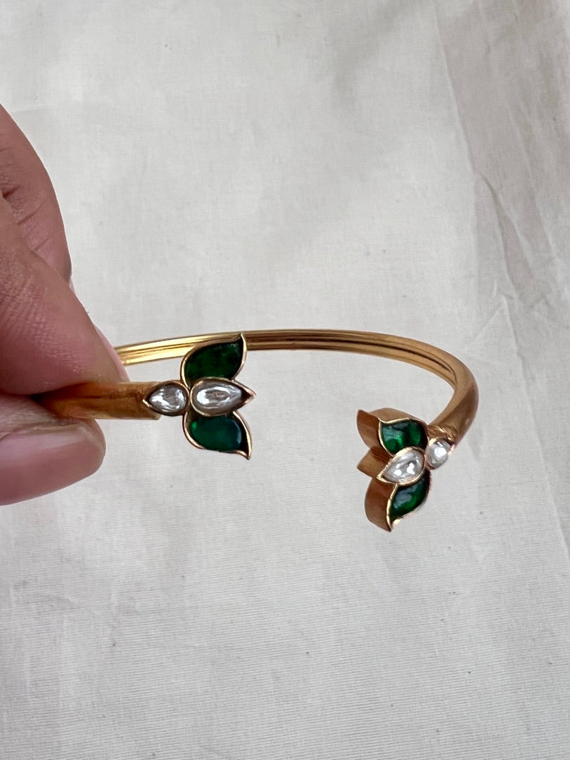 Gold polish kundan and emerald flower kada