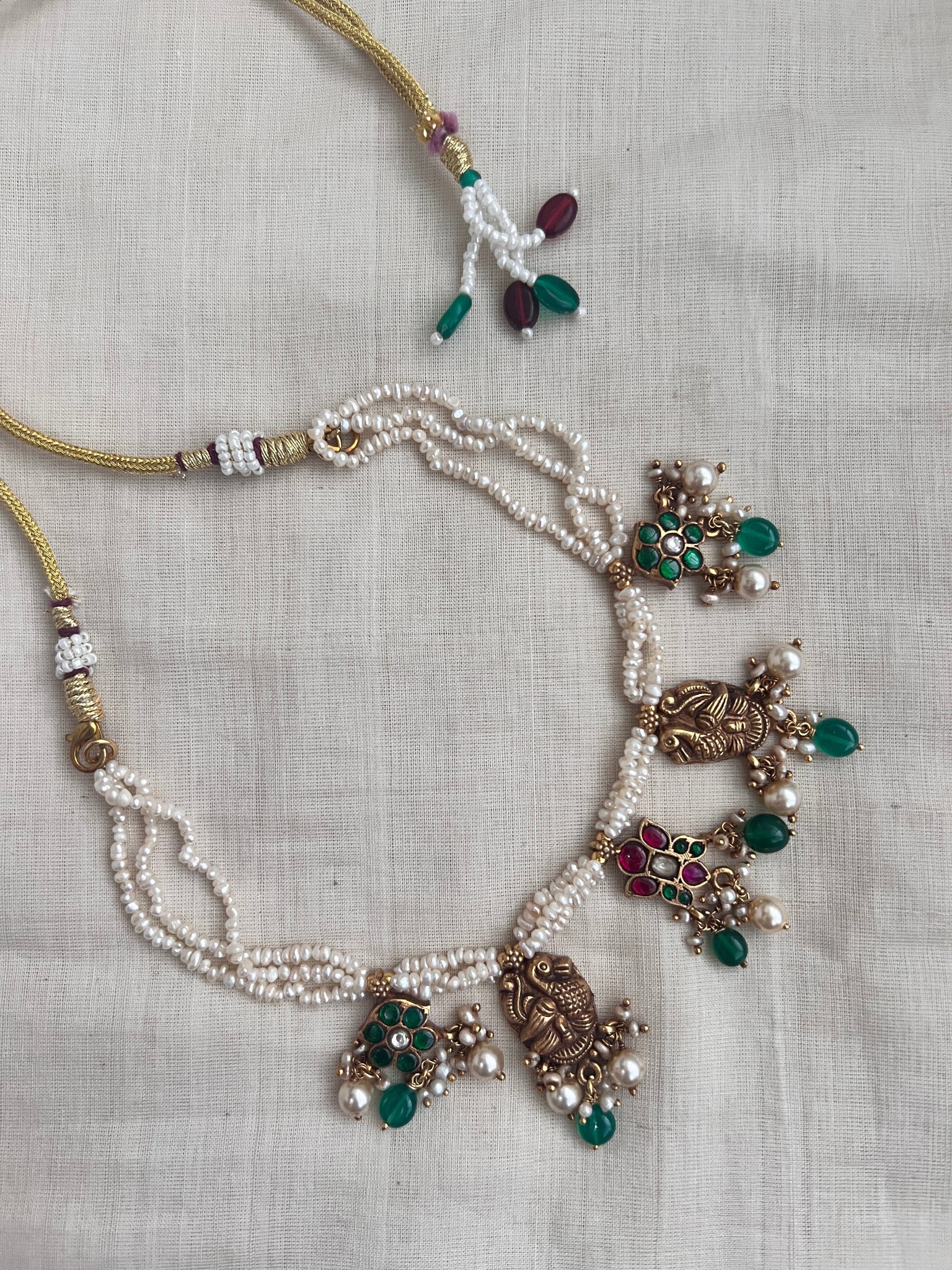 Kundan motifs and peacock nakash with antique pearls – House of Taamara