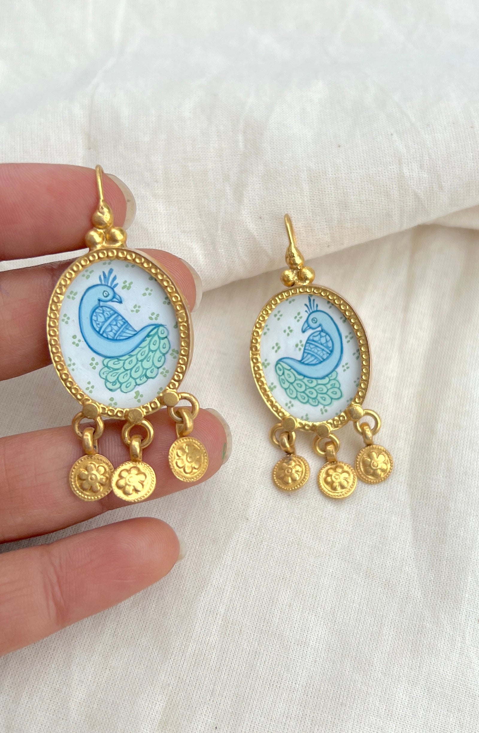 White oval with green blue peacock and flower tassels: gold polish-Silver earrings-EZ-House of Taamara