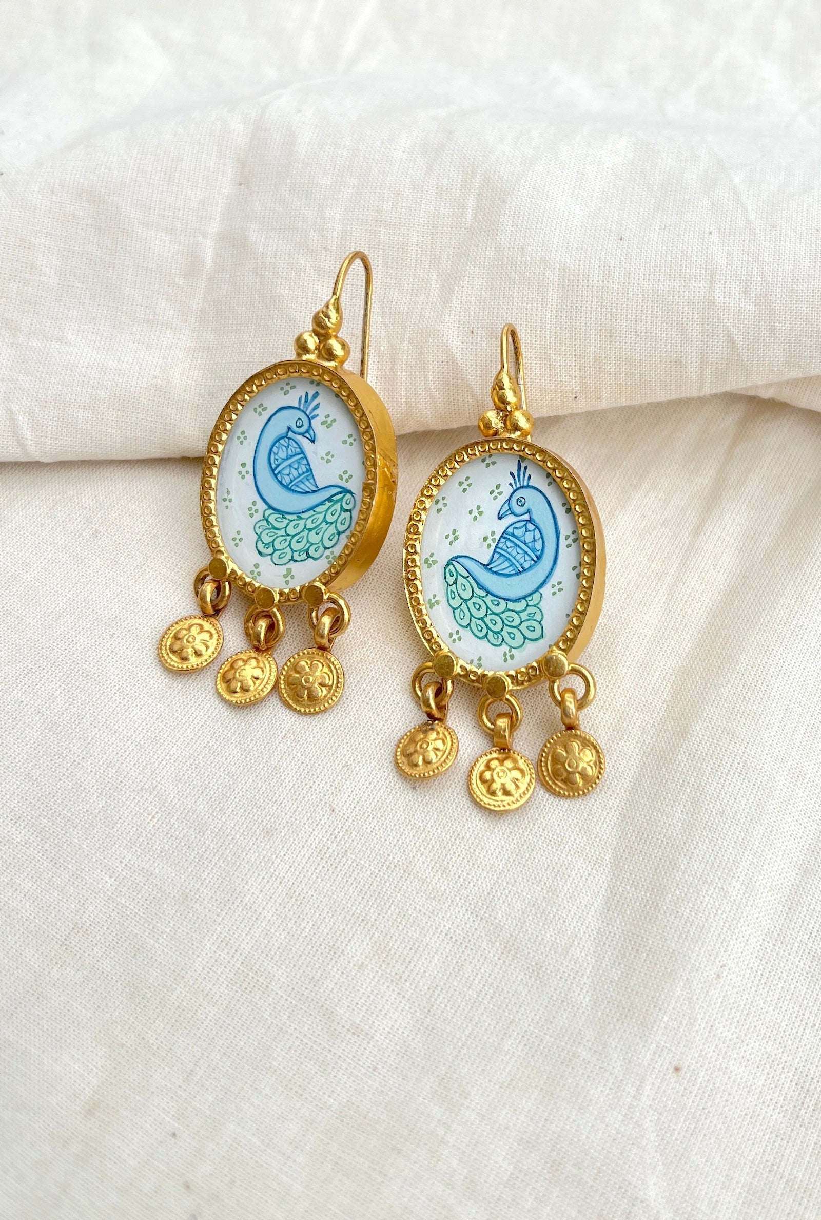 White oval with green blue peacock and flower tassels: gold polish-Silver earrings-EZ-House of Taamara